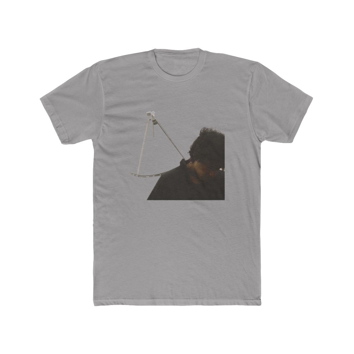 Black T Shirt with a square image of a satellite dish and a person in muted grey and beige tones. The T Shirt is made of a soft, comfortable material